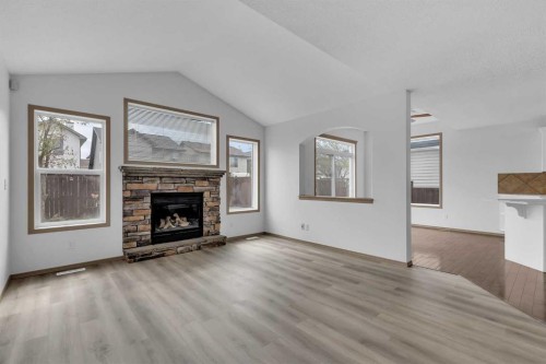 35 New Brighton Manor Se, Calgary, AB - Indoor Photo Showing Living Room With Fireplace
