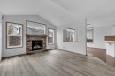 35 New Brighton Manor Se, Calgary, AB  - Indoor Photo Showing Living Room With Fireplace 