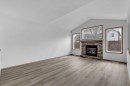 35 New Brighton Manor Se, Calgary, AB  - Indoor Photo Showing Living Room With Fireplace 