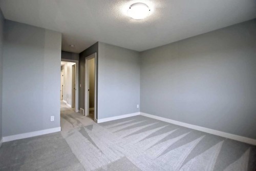 2085 Cobblespring Avenue Sw, Airdrie, AB - Indoor Photo Showing Other Room