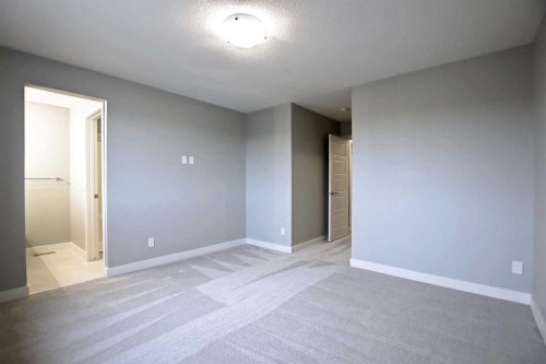 2085 Cobblespring Avenue Sw, Airdrie, AB - Indoor Photo Showing Other Room