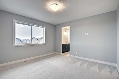 2085 Cobblespring Avenue Sw, Airdrie, AB - Indoor Photo Showing Other Room