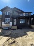 2085 Cobblespring Avenue Sw, Airdrie, AB  - Outdoor With Deck Patio Veranda With Facade 