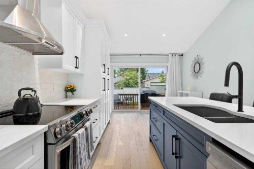 130 Harvest Park Circle Ne, Calgary, AB - Indoor Photo Showing Kitchen With Double Sink