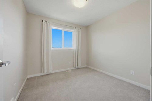 7 Belgian Link, Cochrane, AB - Indoor Photo Showing Other Room