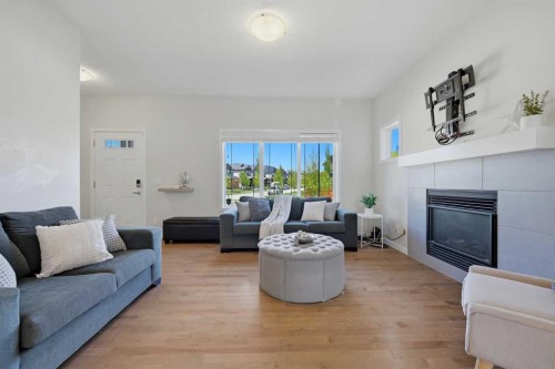 7 Belgian Link, Cochrane, AB - Indoor Photo Showing Living Room With Fireplace