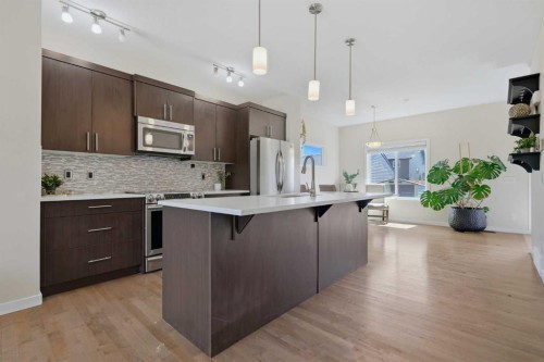 7 Belgian Link, Cochrane, AB - Indoor Photo Showing Kitchen With Stainless Steel Kitchen With Upgraded Kitchen