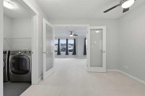 64 Panton Heights Nw, Calgary, AB - Indoor Photo Showing Laundry Room