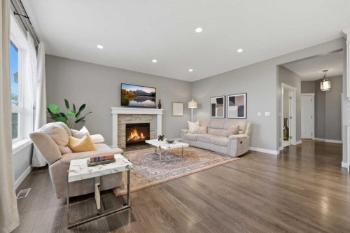 64 Panton Heights Nw, Calgary, AB - Indoor Photo Showing Living Room With Fireplace