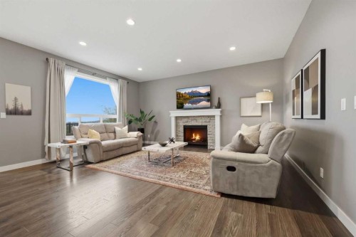 64 Panton Heights Nw, Calgary, AB - Indoor Photo Showing Living Room With Fireplace