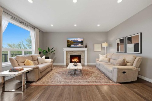 64 Panton Heights Nw, Calgary, AB - Indoor Photo Showing Living Room With Fireplace