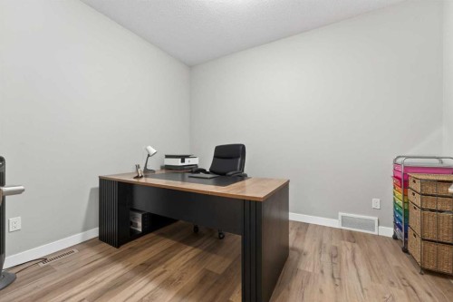 109 Kinniburgh Cove, Chestermere, AB - Indoor Photo Showing Living Room