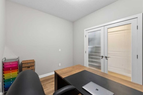 109 Kinniburgh Cove, Chestermere, AB - Indoor Photo Showing Living Room With Fireplace