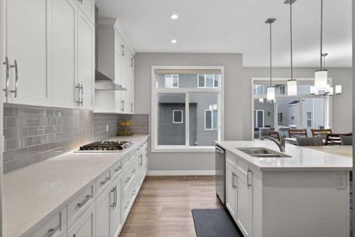 109 Kinniburgh Cove, Chestermere, AB - Indoor Photo Showing Kitchen With Double Sink With Upgraded Kitchen