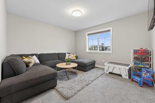 109 Kinniburgh Cove, Chestermere, AB - Indoor Photo Showing Living Room