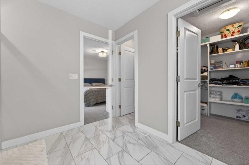 109 Kinniburgh Cove, Chestermere, AB - Indoor Photo Showing Other Room