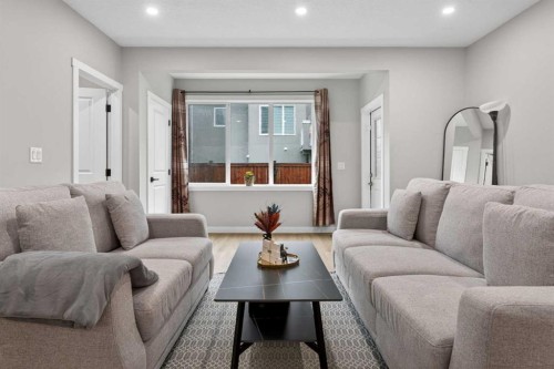 109 Kinniburgh Cove, Chestermere, AB - Indoor Photo Showing Living Room