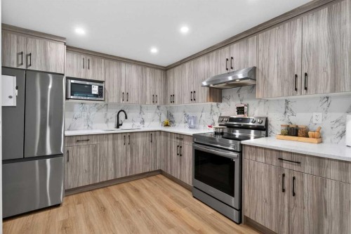 109 Kinniburgh Cove, Chestermere, AB - Indoor Photo Showing Kitchen With Stainless Steel Kitchen