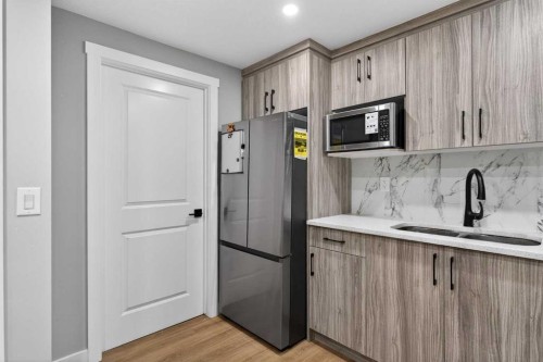 109 Kinniburgh Cove, Chestermere, AB - Indoor Photo Showing Kitchen