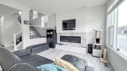 67 Setonstone Row Se, Calgary, AB - Indoor Photo Showing Living Room With Fireplace