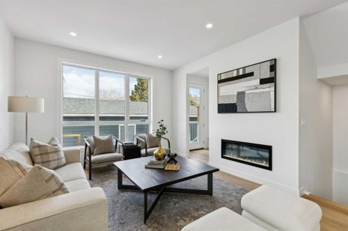 3-440 32 Avenue Nw, Calgary, AB - Indoor Photo Showing Living Room With Fireplace