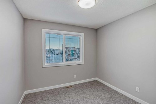 2081 Cobblespring Avenue Sw, Airdrie, AB - Indoor Photo Showing Other Room