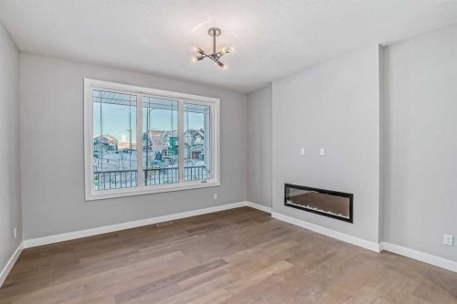 2081 Cobblespring Avenue Sw, Airdrie, AB - Indoor With Fireplace