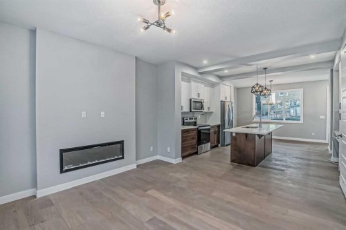 2081 Cobblespring Avenue Sw, Airdrie, AB - Indoor With Fireplace