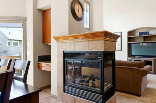 23 Aspen Stone Crescent Sw, Calgary, AB - Indoor With Fireplace