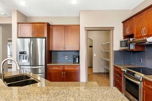 23 Aspen Stone Crescent Sw, Calgary, AB - Indoor Photo Showing Kitchen With Double Sink