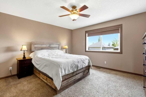 23 Aspen Stone Crescent Sw, Calgary, AB - Indoor Photo Showing Bedroom