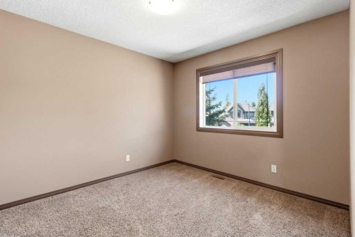 23 Aspen Stone Crescent Sw, Calgary, AB - Indoor Photo Showing Other Room