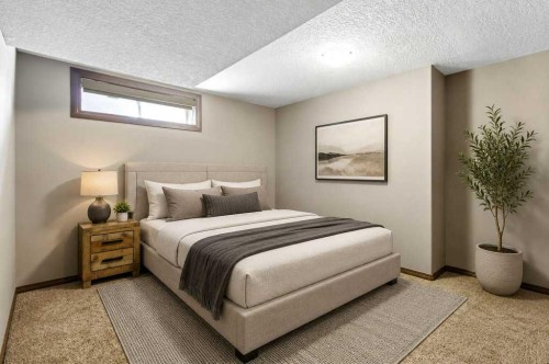 23 Aspen Stone Crescent Sw, Calgary, AB - Indoor Photo Showing Bedroom