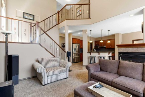 23 Aspen Stone Crescent Sw, Calgary, AB - Indoor Photo Showing Living Room With Fireplace