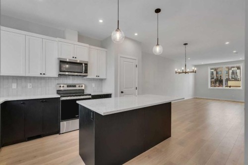 229 Heirloom Way Se, Calgary, AB - Indoor Photo Showing Kitchen With Stainless Steel Kitchen With Upgraded Kitchen