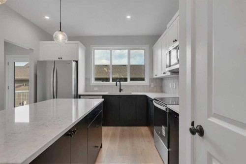 229 Heirloom Way Se, Calgary, AB - Indoor Photo Showing Kitchen With Upgraded Kitchen