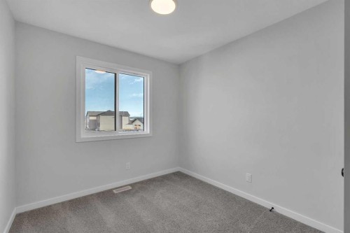 229 Heirloom Way Se, Calgary, AB - Indoor Photo Showing Other Room