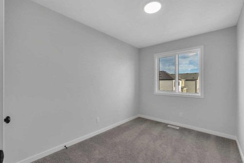 229 Heirloom Way Se, Calgary, AB - Indoor Photo Showing Other Room