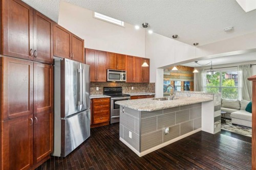 1807 New Brighton Drive Se, Calgary, AB - Indoor Photo Showing Kitchen With Stainless Steel Kitchen