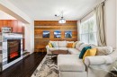 1807 New Brighton Drive Se, Calgary, AB  - Indoor Photo Showing Living Room With Fireplace 