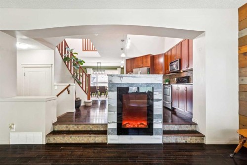 1807 New Brighton Drive Se, Calgary, AB - Indoor With Fireplace