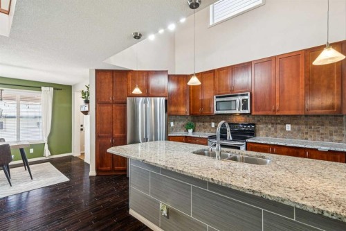 1807 New Brighton Drive Se, Calgary, AB - Indoor Photo Showing Kitchen With Stainless Steel Kitchen With Double Sink With Upgraded Kitchen