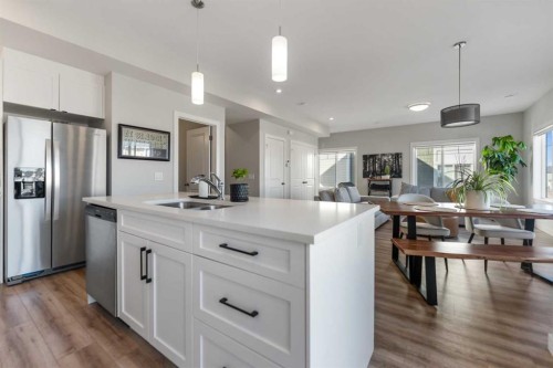 258 Canals Crossing Sw, Airdrie, AB - Indoor Photo Showing Kitchen With Double Sink With Upgraded Kitchen