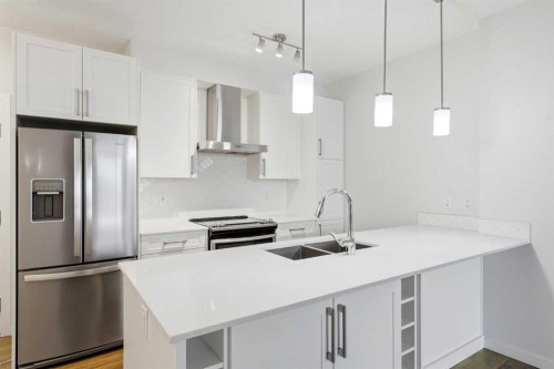 212-122 Mahogany Centre Se, Calgary, AB - Indoor Photo Showing Kitchen With Double Sink With Upgraded Kitchen