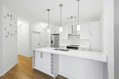 212-122 Mahogany Centre Se, Calgary, AB - Indoor Photo Showing Kitchen With Double Sink With Upgraded Kitchen