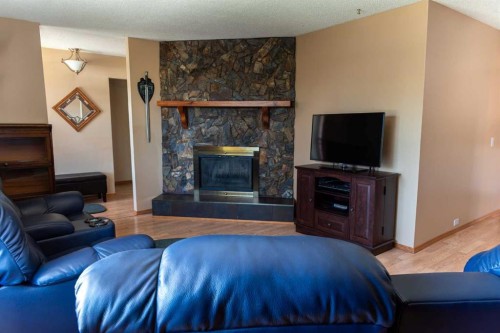 164 Huntford Road Ne, Calgary, AB - Indoor Photo Showing Living Room With Fireplace