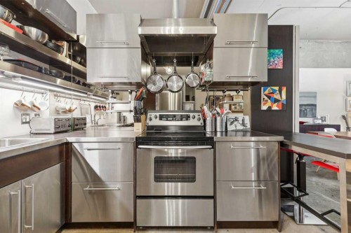 102D-500 Eau Claire Avenue Sw, Calgary, AB - Indoor Photo Showing Kitchen With Stainless Steel Kitchen