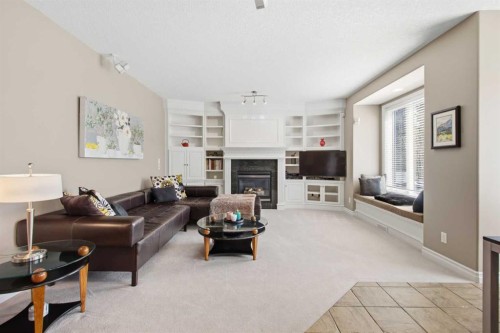 36 Hampstead Hill Nw, Calgary, AB - Indoor Photo Showing Living Room With Fireplace