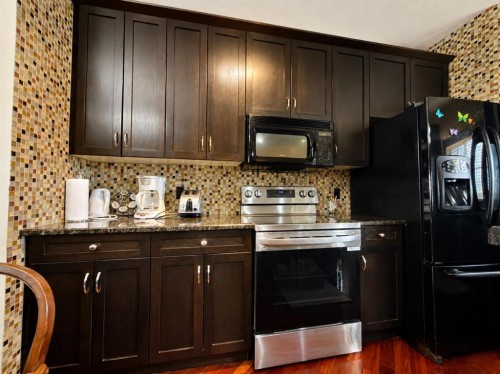 288 Rainbow Falls Drive, Chestermere, AB - Indoor Photo Showing Kitchen