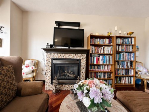 288 Rainbow Falls Drive, Chestermere, AB - Indoor Photo Showing Living Room With Fireplace